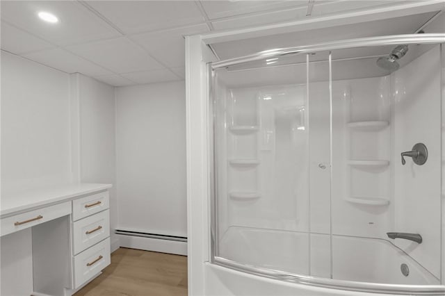 196 Stillwater Rd, Smithfield, RI 02917 - bathroom featuring a baseboard heating unit, shower / washtub combination, and wood finished floors