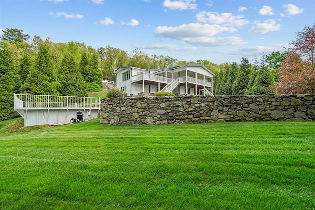 196 Stillwater Rd, Smithfield, RI 02917 - rear view of property with a lawn, a wooden deck, and an outdoor pool