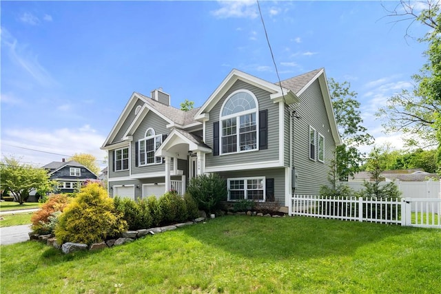 228 Morse Ave, Woonsocket, RI 02895 - bi-level home featuring a chimney and a garage