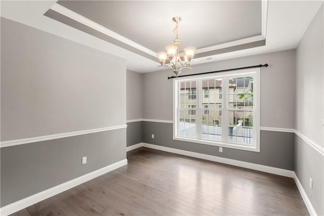 228 Morse Ave, Woonsocket, RI 02895 - unfurnished room featuring a tray ceiling, a chandelier, wood-type flooring, and baseboards