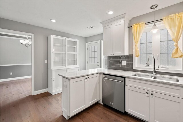 228 Morse Ave, Woonsocket, RI 02895 - kitchen with dishwasher, a sink, white cabinetry, dark wood-type flooring, and baseboards