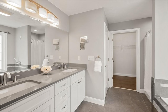 228 Morse Ave, Woonsocket, RI 02895 - bathroom with double vanity, baseboards, tile patterned flooring, and curtained shower