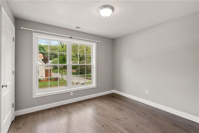 228 Morse Ave, Woonsocket, RI 02895 - unfurnished room with baseboards and dark wood-style floors