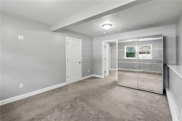 228 Morse Ave, Woonsocket, RI 02895 - unfurnished bedroom featuring a baseboard radiator, carpet flooring, baseboards, beam ceiling, and a closet