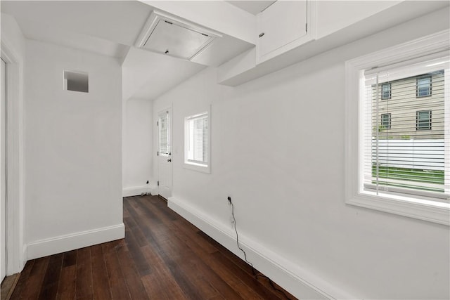 228 Morse Ave, Woonsocket, RI 02895 - empty room featuring attic access, dark wood-type flooring, and baseboards