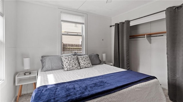 21 Meadowrue Trl, Narragansett, RI 02874 - bedroom featuring a closet, carpet, crown molding, and baseboards
