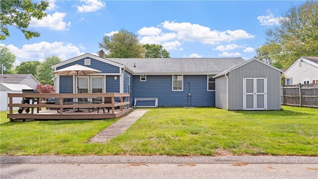 21 Meadowrue Trl, Narragansett, RI 02874 - back of property with a deck and a chimney