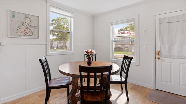 21 Meadowrue Trl, Narragansett, RI 02874 - dining room featuring light wood-style floors, crown molding, and baseboards