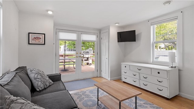 21 Meadowrue Trl, Narragansett, RI 02874 - living room with french doors, light wood finished floors, and baseboards