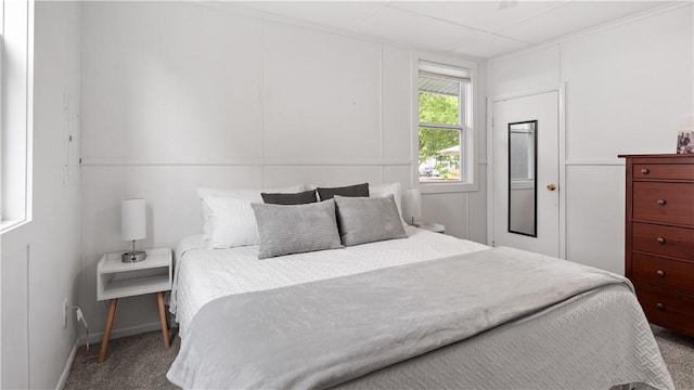 21 Meadowrue Trl, Narragansett, RI 02874 - carpeted bedroom with a decorative wall and baseboards