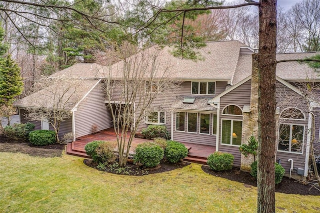 60 Pheasant Dr, East Greenwich, RI 02818 - rear view of property featuring a wooden deck, a lawn, and roof with shingles