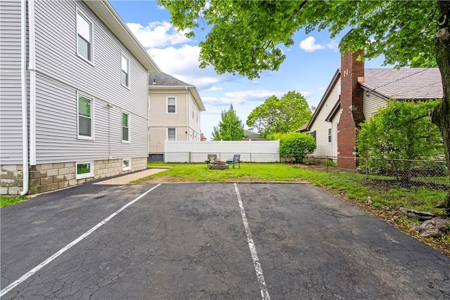 1362 Newport Ave, Pawtucket, RI 02861 - uncovered parking lot with a fenced backyard