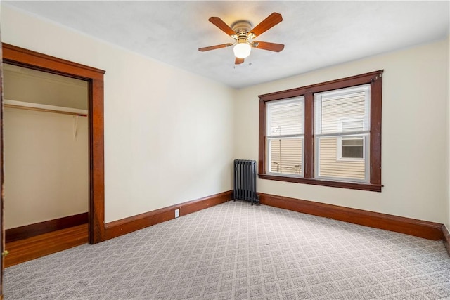 1362 Newport Ave, Pawtucket, RI 02861 - unfurnished bedroom featuring radiator heating unit, baseboards, light carpet, and a closet