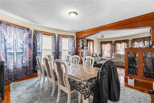 1362 Newport Ave, Pawtucket, RI 02861 - dining space with wood finished floors and a textured ceiling