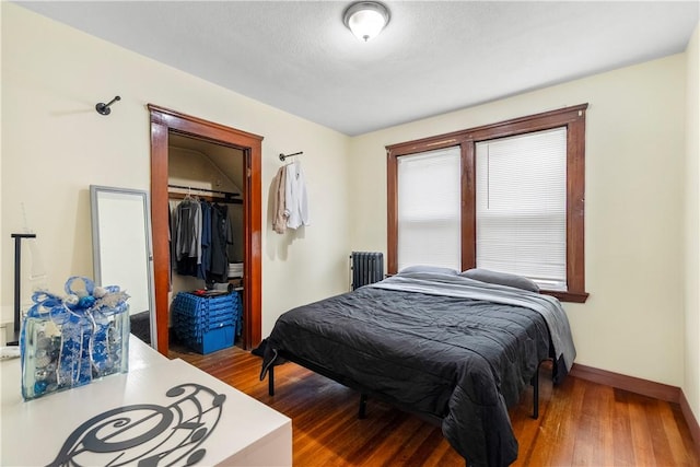 1362 Newport Ave, Pawtucket, RI 02861 - bedroom with a closet, wood finished floors, radiator heating unit, and baseboards