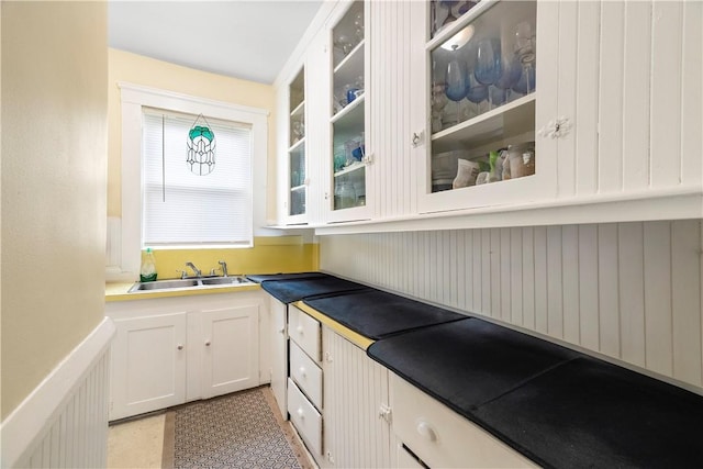 1362 Newport Ave, Pawtucket, RI 02861 - kitchen with a sink, glass insert cabinets, and white cabinetry