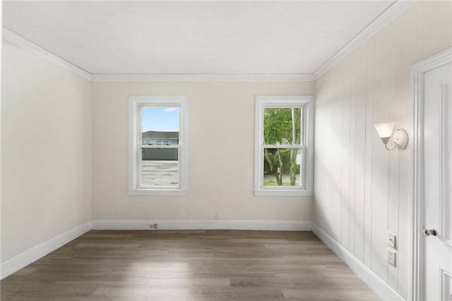 1875 Smith St, North Providence, RI 02911 - unfurnished room with ornamental molding, light wood finished floors, and baseboards