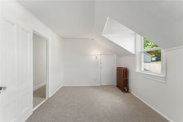 1875 Smith St, North Providence, RI 02911 - bonus room featuring radiator, carpet flooring, lofted ceiling, and baseboards