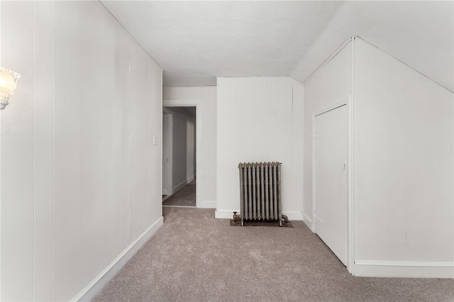 1875 Smith St, North Providence, RI 02911 - bonus room with radiator heating unit, carpet floors, and baseboards