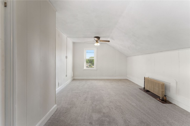 1875 Smith St, North Providence, RI 02911 - additional living space featuring radiator heating unit, carpet flooring, ceiling fan, vaulted ceiling, and baseboards