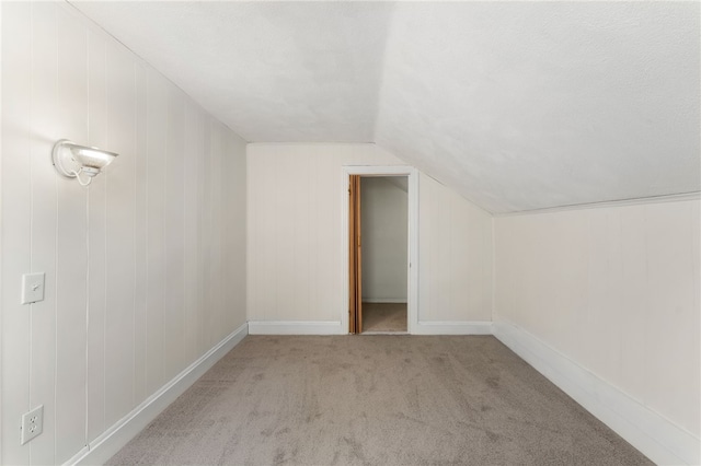 1875 Smith St, North Providence, RI 02911 - additional living space featuring carpet floors and vaulted ceiling
