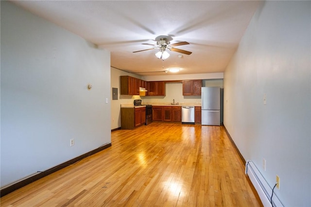 444 Woodward Rd Unit 23, North Providence, RI 02904 - kitchen with stainless steel appliances, a baseboard heating unit, ceiling fan, light countertops, and a sink