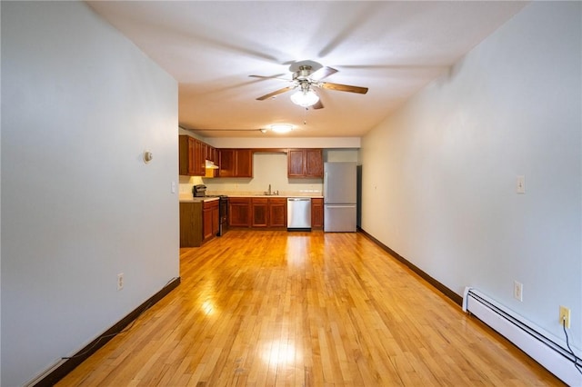 444 Woodward Rd Unit 23, North Providence, RI 02904 - unfurnished living room with baseboard heating, a sink, ceiling fan, light wood-type flooring, and baseboards