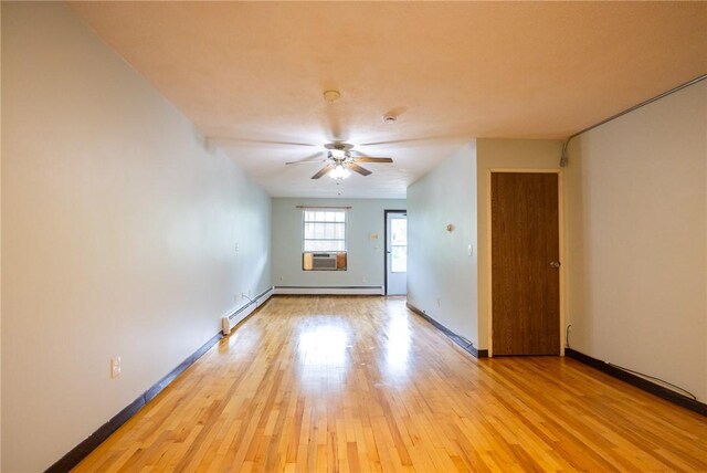 444 Woodward Rd Unit 23, North Providence, RI 02904 - empty room featuring a baseboard radiator, light wood-type flooring, a ceiling fan, and cooling unit