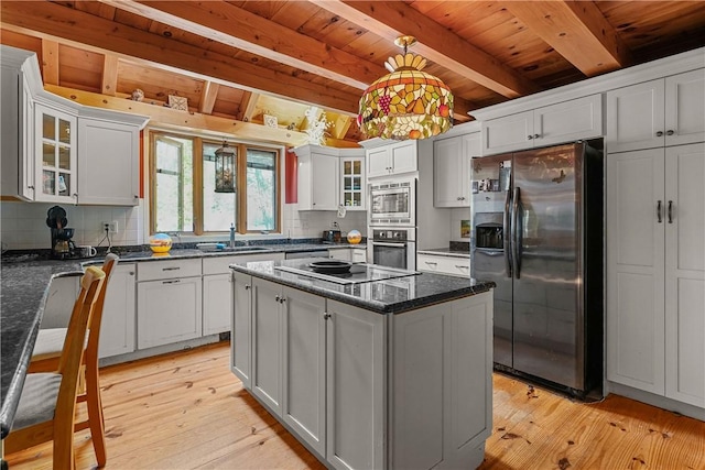 94 S Shore Rd, Burrillville, RI 02859 - kitchen featuring stainless steel appliances, a sink, decorative backsplash, wooden ceiling with exposed beams, and light wood-type flooring