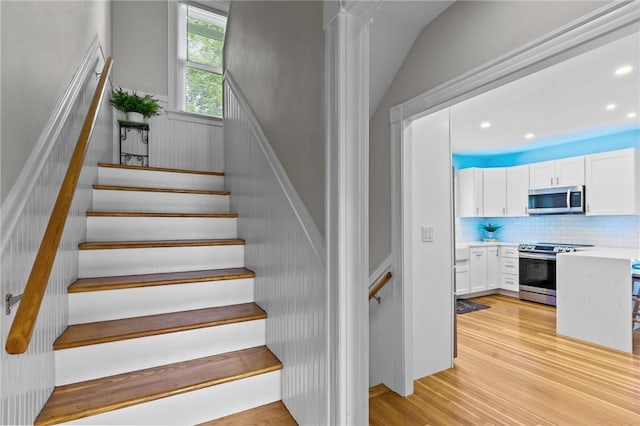 36 Ruth Ave, East Providence, RI 02916 - staircase with a wainscoted wall, wood finished floors, and recessed lighting