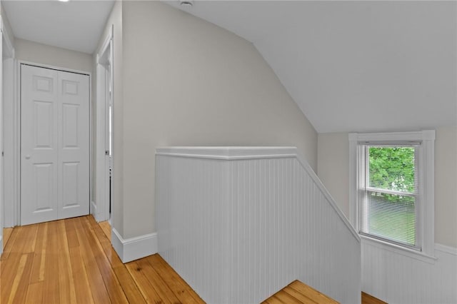 36 Ruth Ave, East Providence, RI 02916 - hall with an upstairs landing, light wood finished floors, vaulted ceiling, and wainscoting