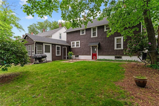36 Ruth Ave, East Providence, RI 02916 - rear view of property with a patio and a lawn