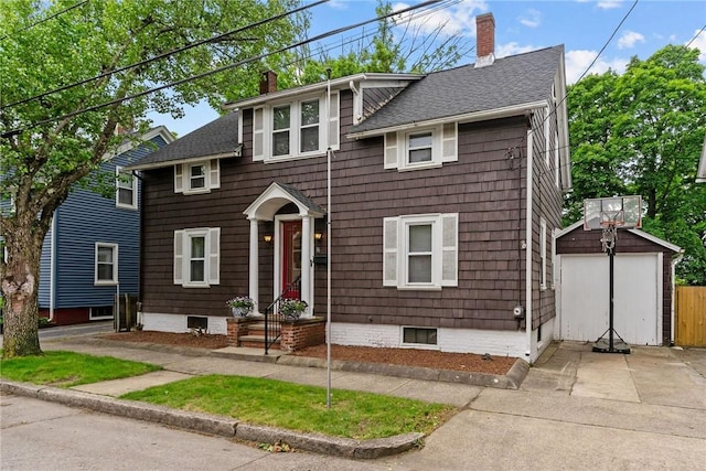 36 Ruth Ave, East Providence, RI 02916 - view of front of home featuring a chimney, concrete driveway, an outbuilding, and a shingled roof