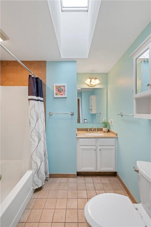 101 Huckleberry Rd, North Kingstown, RI 02852 - full bath with toilet, vanity, shower / bathtub combination with curtain, tile patterned flooring, and baseboards