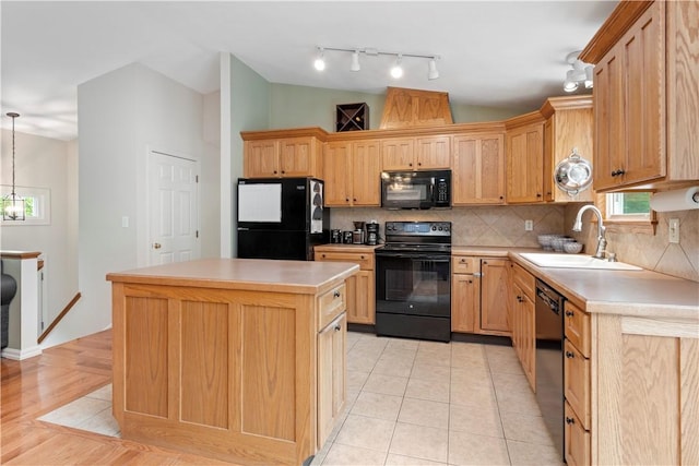101 Huckleberry Rd, North Kingstown, RI 02852 - kitchen featuring black appliances, a sink, a center island, backsplash, and light countertops