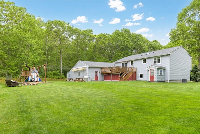101 Huckleberry Rd, North Kingstown, RI 02852 - view of green lawn featuring a wooden deck, stairs, and central air condition unit