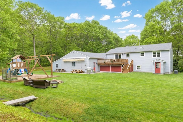 101 Huckleberry Rd, North Kingstown, RI 02852 - rear view of property featuring a deck, stairs, a playground, and a lawn