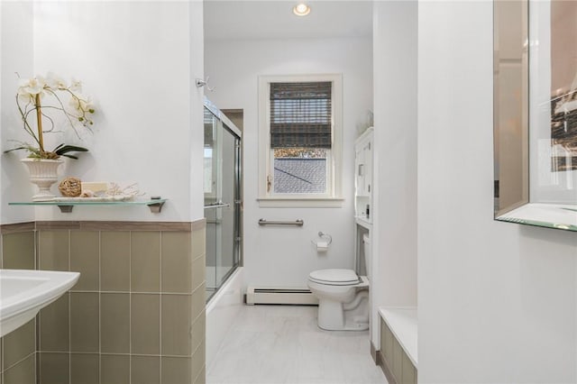 85 Frigate St, Jamestown, RI 02832 - bathroom with baseboard heating, toilet, marble look tile flooring, bath / shower combo with glass door, and recessed lighting