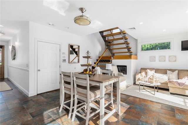 85 Frigate St, Jamestown, RI 02832 - dining space with stone tile flooring, baseboards, and recessed lighting