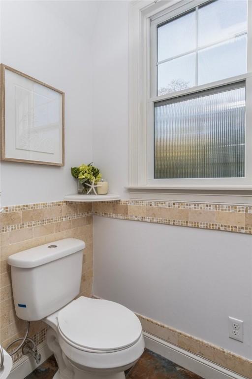 85 Frigate St, Jamestown, RI 02832 - half bath with tile walls, toilet, and wainscoting