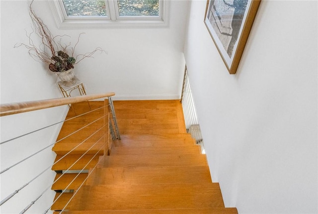 85 Frigate St, Jamestown, RI 02832 - staircase with wood finished floors and baseboards