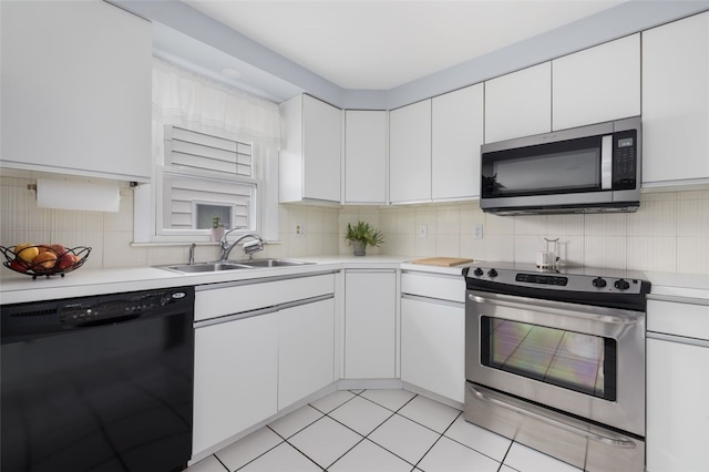 150 Memorial Dr, Pawtucket, RI 02860 - kitchen with appliances with stainless steel finishes, light countertops, white cabinetry, and backsplash