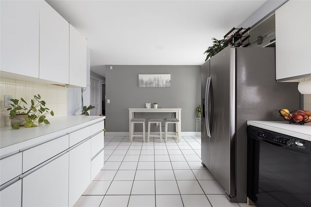 150 Memorial Dr, Pawtucket, RI 02860 - kitchen featuring black dishwasher, tasteful backsplash, light countertops, and white cabinets