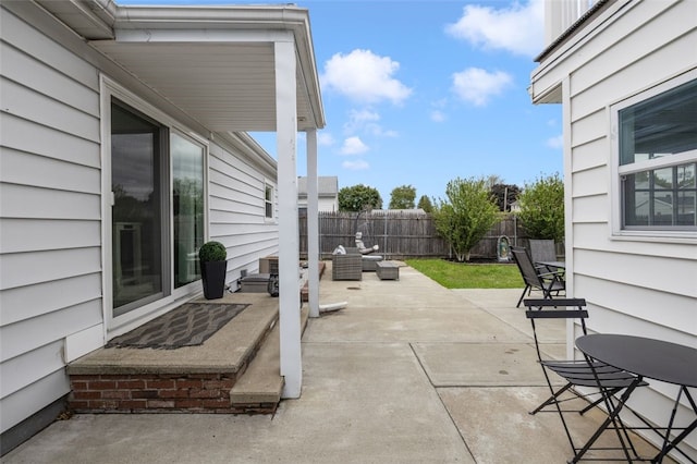 150 Memorial Dr, Pawtucket, RI 02860 - fenced backyard featuring a patio area and an outdoor hangout area