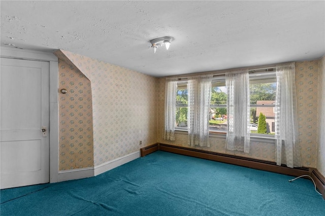 8 Tampa St, West Warwick, RI 02893 - unfurnished room with wallpapered walls, carpet, plenty of natural light, a textured ceiling, and a baseboard radiator