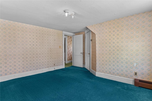 8 Tampa St, West Warwick, RI 02893 - empty room with wallpapered walls, carpet, baseboard heating, and baseboards