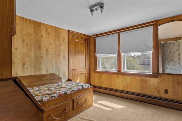 8 Tampa St, West Warwick, RI 02893 - bedroom with a baseboard heating unit, wood walls, and carpet