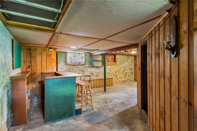 8 Tampa St, West Warwick, RI 02893 - below grade area with a bar and wood walls