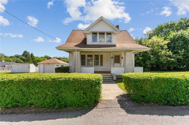 8 Tampa St, West Warwick, RI 02893 - bungalow with covered porch, an outdoor structure, and a chimney