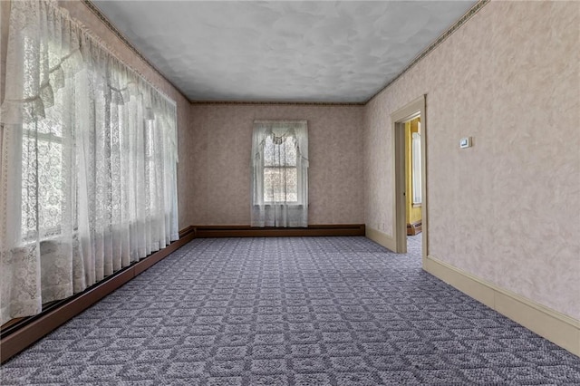 8 Tampa St, West Warwick, RI 02893 - spare room featuring carpet, a baseboard heating unit, crown molding, and baseboards
